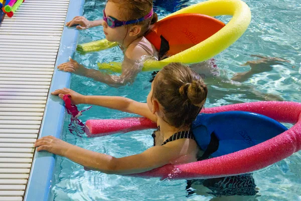 Children practising with pool noodles at M Swim Academy, Stoke-on-Trent